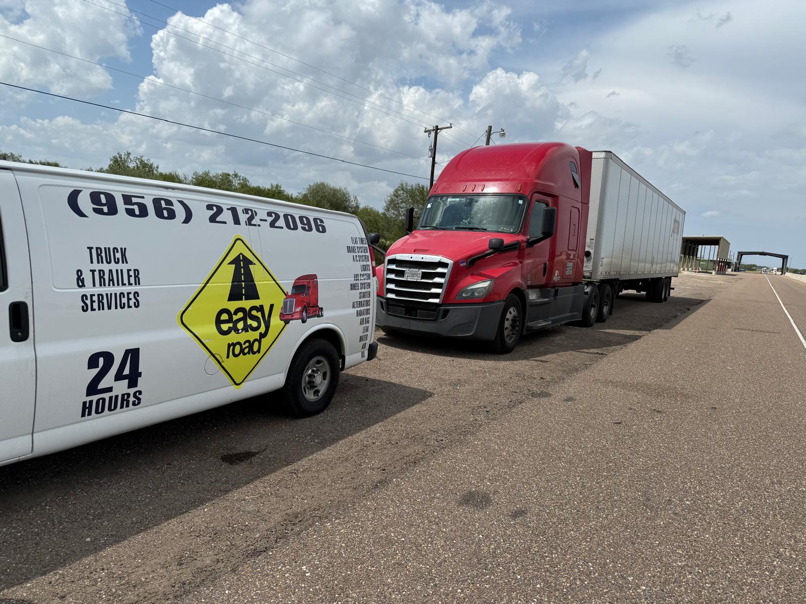 Easy Road van alongside red semi-truck