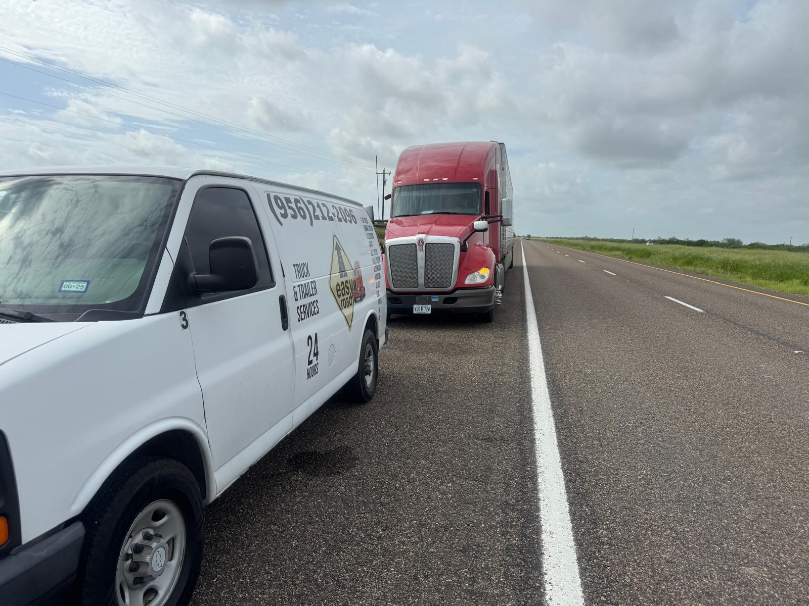 Roadside assist — red Kenworth semi